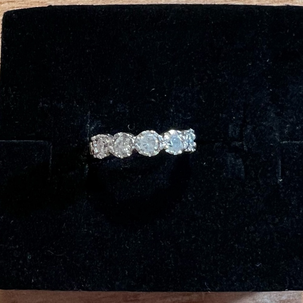 Elegant Silver tone single hoop earring.